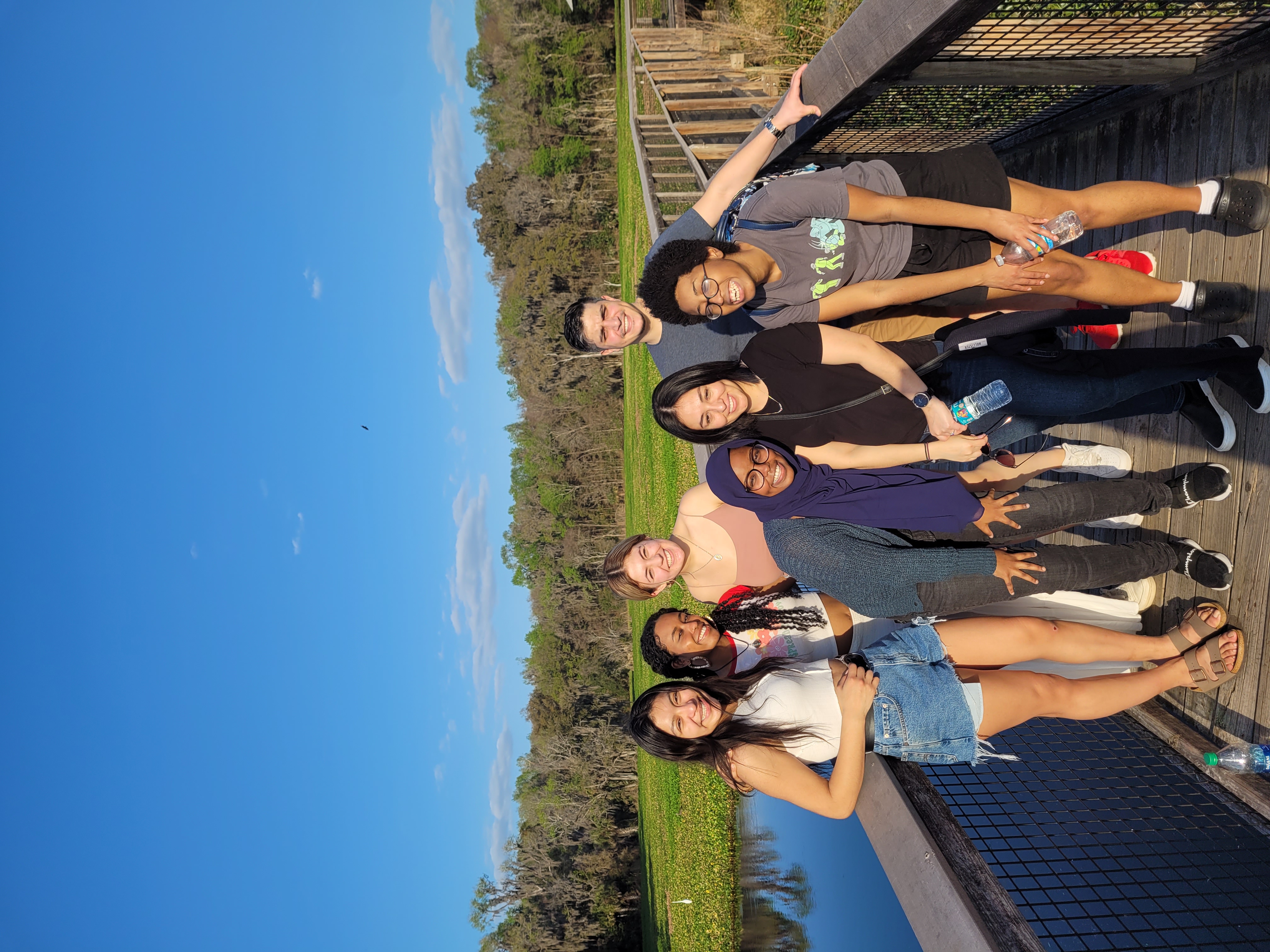 A group of participants with their guide, Alnycea Blackwell, pause their alligator searh for a photo during a visit to La Chua Trail. 