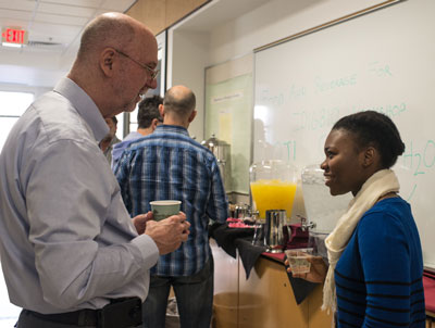 Helen Fowowe of Salem College and Gil Nelson chat at break